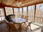 Main level screen porch with outdoor dining for 6